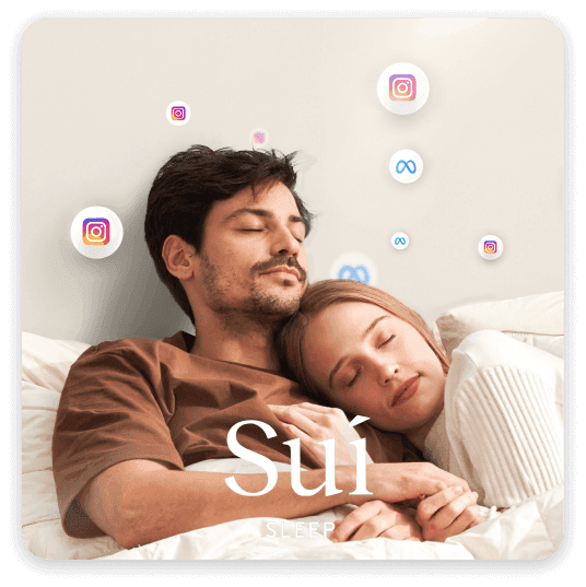 Cute couple sleeping in bed, surrounded by Meta and Instagram logos, representing Sui Sleep e-commerce's AI ad-driven increase in conversion rates.