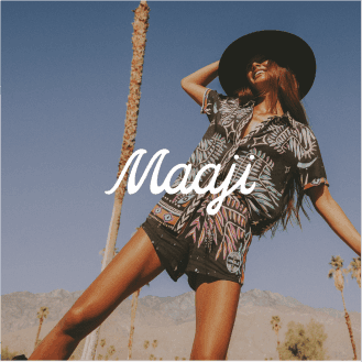 Colorful shot of a person in a floral summer outfit with a black hat and the Maji logo, featuring a vibrant AI-enhanced ad template optimized for high-impact campaigns on Facebook stories and Instagram reels.